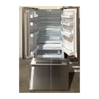 Interior view of Fisher & Paykel RF170ADX4N 32 inch french door refrigerator, showing adjustable shelves and crisper drawer, open box