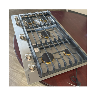 Complete view of JennAir JGC3536GS 36-inch gas cooktop showing all 5 burners and stainless steel finish, open box